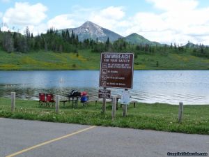 camp-out-colorado-steamboat-lake-swim-beach-sign